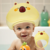 TinyGuardian baby shower cap yellow front view keeps water and shampoo foam away from eyes.