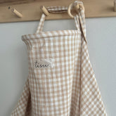 TISU nursing cover demonstrates breastfeeding privacy in public settings for discreet feeding.