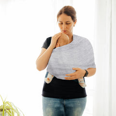 TKKOK Baby Wrap Carrier draped on parent demonstrates hands-free everyday versatility.