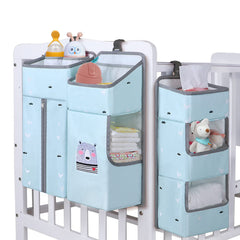 TOCKONIMN hanging diaper caddy sky blue by crib for quick diaper access.