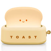 TOOGE toast lamp side view creates cozy bedroom ambience with soft light.