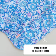 Torange baby smock bib featuring built-in food catcher pocket.