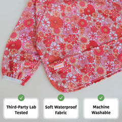 Torange smock bib elastic cuffs close-up demonstrates secure tug-proof fit.