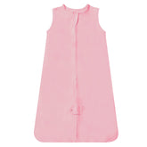 TotAha light sleep sack on baby lying down for cozy sleep.