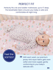 TotAha Pink Rainbow crib sheets on a baby in crib illustrating cozy, secure comfort