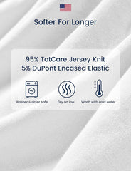 TotAha sheets in use on Graco Pack 'n Play, baby resting comfortably.