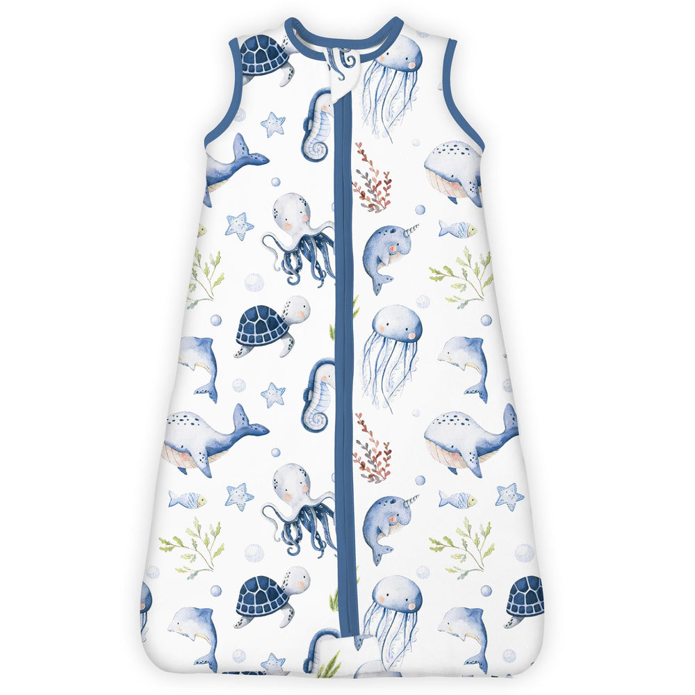TotBASIC 1.0 Tog sleep sack worn by toddler in ocean animals print for safe sleep.