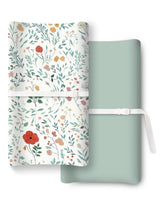 TOTCHILL changing pad cover shows two-color design for snug, comfortable diaper changes.