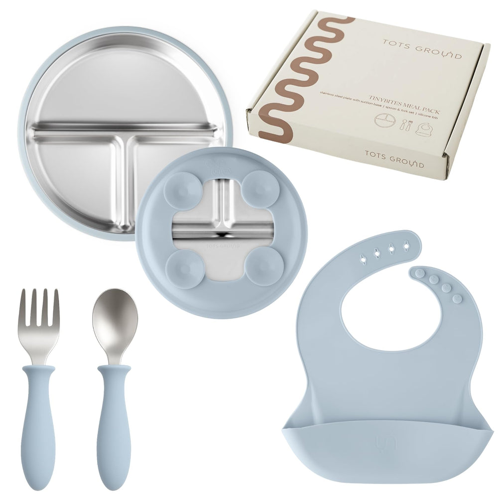 TOTS GROUND suction plate on tray for spill-free meals.