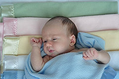 Toysdone pink satin-trim blanket closeup, silky edge adds gentle luxury and visual contrast.