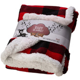 TrailCrest ultra-soft sherpa fleece plaid blanket draped over a crib for cozy warmth.