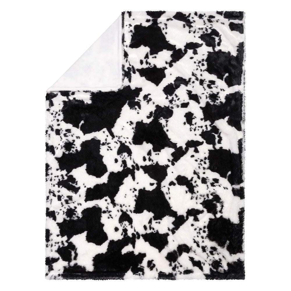 Trend Lab cow print plush front with soft, cuddly texture.
