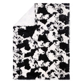 Trend Lab cow print plush front with soft, cuddly texture.