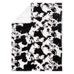Trend Lab cow print plush front with soft, cuddly texture.