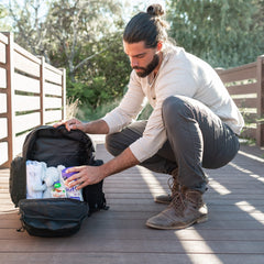 Tridee Dad Diaper Bag wipe dispenser demonstrates easy-access cleaning on the go.