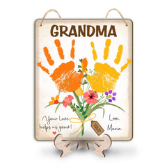 TRUMPETIC baby handprint flowers sign close-up detail with vivid colors for display