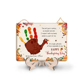 TRUMPETIC DIY turkey handprint sign shows a child's print; a cherished first Thanksgiving keepsake.