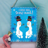 TRUMPETIC snowman footprint sign front view for baby keepsake display.