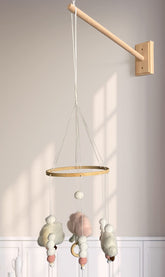 Tuiiopoli crib-mobile-arm installation shows universal-fit wall mount.