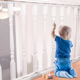 Tupi Banister Guard in white honeycomb mesh keeps babies safe with clear visibility.