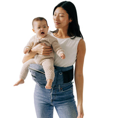 TushBaby ergonomic design demonstrates balanced weight for back-friendly carrying.