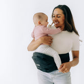 TushBaby original hip seat carrier with secure buckles for on-the-go safety.