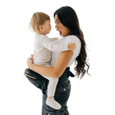 TushBaby Original hip-seat front view shows ergonomic support for growing babies