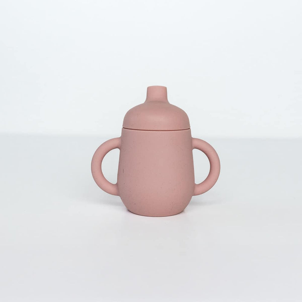 TushBaby Sippy Cup with soft spout for easy self-feeding and reduced spills.
