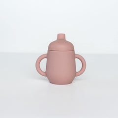 TushBaby Sippy Cup with soft spout for easy self-feeding and reduced spills.