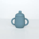 TushBaby Training Cup with soft spout supports gentle sipping and reduced spills.