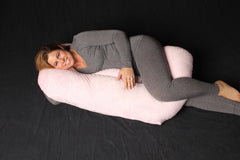 Twin Z pillow with pink cover in use for twin infants comfort.