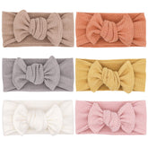 UeeSum dusty rose headband bow with soft stretch for comfy newborn wear
