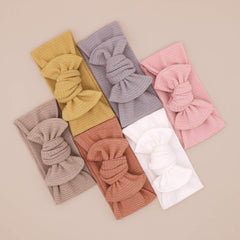 UeeSum white headband bow ideal for newborn photos and breathable wear