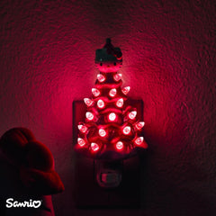 Ukonic Sanrio Hello Kitty pink 6-inch nightlight plug-in view demonstrates easy wall outlet use.