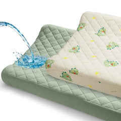 Unicorn Castle muslin changing pad cover with green dinosaur print for 32x16 diaper changes.