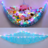 Unicorn Castle hammock with LED light in a corner storage setup for plush toys