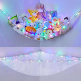 Unicorn Castle stuffed animals hammock ready for easy toy organization in a kids' room.