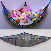 Unicorn Castle toy hammock hanging in a kid's corner for organized plush storage.