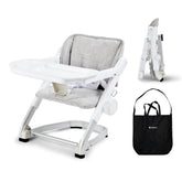 Unilove Feed Me 3-in-1 travel high chair folded for compact storage during trips.
