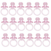 Unique pink acrylic crystal pacifier favor close-up, showcasing table decor sparkle and playful baby-shower charm.