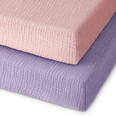 Unnivoll muslin pack and play sheets folded showing soft breathable fabric for baby comfort