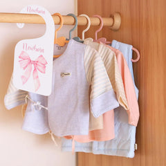 Bow-style nursery divider helps busy parents categorize clothes efficiently.