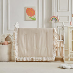 UOZZI Bedding pink lace-detail highlighting nursery charm and warmth