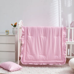 UOZZI BEDDING quilted-comforter-34x43-ruffle adds charming detail to nursery.