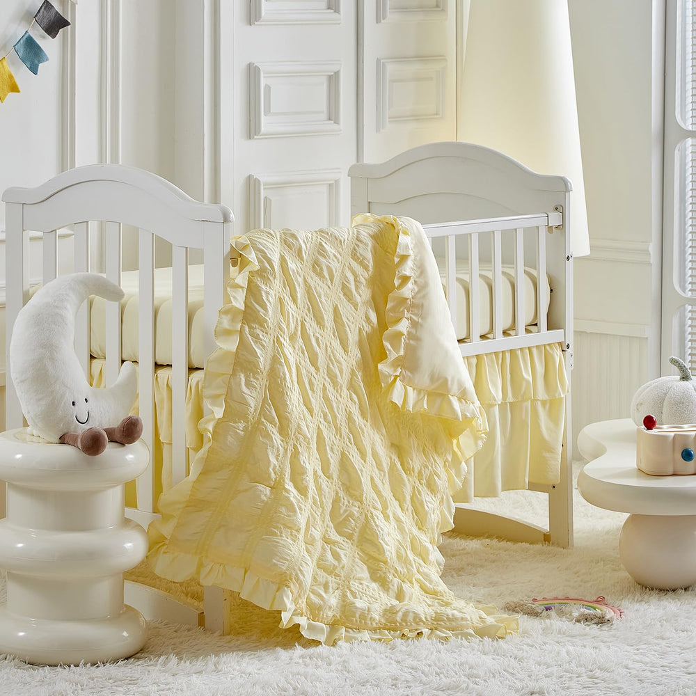 Uozzi Bedding ruffled crib comforter close-up yellow for cozy warmth