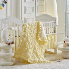 Uozzi Bedding ruffled crib comforter close-up yellow for cozy warmth
