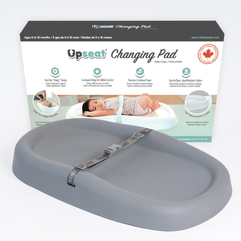 Upseat baby changing pad with non-slip grippy design for secure diaper changes.