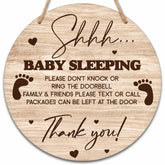 Valucise baby sleeping sign on front door, round wood with rope for quiet entry reminders.