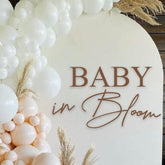 VANGNING Baby in Bloom decal sign on a festive backdrop for a memorable baby shower