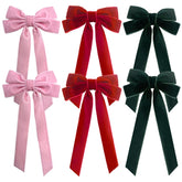 Velvet Bows Hair Clips in red add chic holiday flair to everyday hairstyles